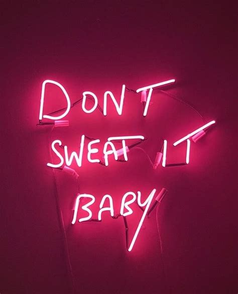 neon sign saying "don't sweat it baby"